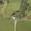 Oblique aerial view centred on the farmhouse with the farmsteading adjacent, taken from the NW.