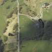 Oblique aerial view centred on the remains of the clearance cairns with the limekiln adjacent, taken from the SE.