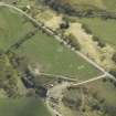 Oblique aerial view centred on the remains of the clearance cairns with the limekiln adjacent, taken from the N.