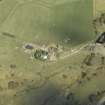 Oblique aerial view centred on the farmsteading, taken from the NW.