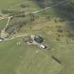 Oblique aerial view centred on the farmsteading, taken from the E.