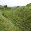 View.  Tramway cutting leading to buried magazines from SE.