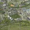 Oblique aerial view centred on the cathedral and hospital, taken from the SW.