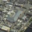 Oblique aerial view centred on the shopping centre, taken from the W.