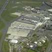 Oblique aerial view of the terminal buildings and apron, taken from the SW.