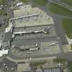 Oblique aerial view of the terminal buildings and apron, taken from the E.