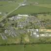 Oblique aerial view of the former hospital, taken from the SE.