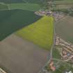 General oblique aerial view centred on the cropmarks of the rig with the villages adjacent, taken from the SSW.