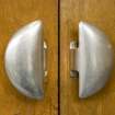 Interior. Ground floor. Main assembly hall door handles. Detail