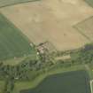 Oblique aerial view centred on the house with the road bridge adjacent, taken from the SE.