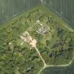 Oblique aerial view centred on the country house, stable block, dovecot and walled garden, taken from the SW.