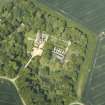 Oblique aerial view centred on the country house, stable block, dovecot and walled garden, taken from the SE.