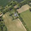 Oblique aerial view centred on the country house, garden and stables with the dovecots adjacent, taken from the ESE.