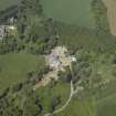 Oblique aerial view centred on the country house with the farmstead, sawmill and dovecot adjacent, taken from the S.