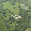 General oblique aerial view centred on the country house with the farmstead, walled garden, cottages, sawmill and dovecot adjacent, taken from the SE.