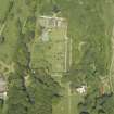 Oblique aerial view centred on the walled garden and orangery with the stables and cottages adjacent, taken from the SSW.