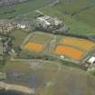 Oblique aerial view centred on the settling ponds, taken from the SE.