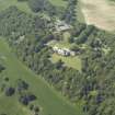 General oblique aerial view centred on the country house and stable block, taken from the ESE.