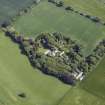 Oblique aerial view centred on the country house, conservatory, dovecot and farmsteading, taken from the NW.