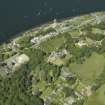 General oblique aerial view centred on the town and country house, taken from the NE.