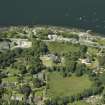 General oblique aerial view centred on the town and country house, taken from the NNE.