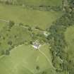 Oblique aerial view centred on the house, taken from the SE.