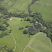 General oblique aerial view centred on the house, taken from the SW.