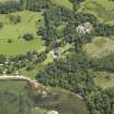 Oblique aerial view centred on the house, taken from the NW.