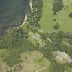 Oblique aerial view centred on the house, taken from the S.