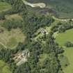 Oblique aerial view centred on the house, taken from the E.