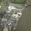 Oblique aerial view.  Alloa Glass Works, gasholder and harbour from W.