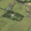 Oblique aerial view centred on the house, walled garden and gate piers, taken from the NE.