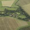 Oblique aerial view centred on the country house, cottage and walled garden, taken from the N.