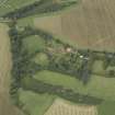 Oblique aerial view centred on the country house, cottage and walled garden, taken from the SSE.