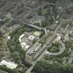 Oblique aerial view centred on the academy with the road bridge adjacent, taken from the NNE.