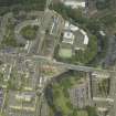 Oblique aerial view centred on the academy  and road bridge, taken from the SSW.