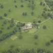 Oblique aerial view centred on the country house, stable block and walled garden, taken from the SE.