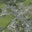 Oblique aerial view of the town centred on the churches, taken from the NW.