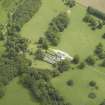 Oblique aerial view centred on the country house, taken from the WNW.