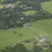 General oblique aerial view centred on the farmsteading and stallion house with the country house adjacent, taken from the NE.