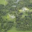 Oblique aerial view centred on the country house, walled garden and farmsteading, taken from the S.