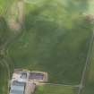 Oblique aerial view centred on the cropmarks of the unenclosed settlement and pits, taken from the SW.