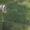 Oblique aerial view centred on the cropmarks of the unenclosed settlement, pits and pit-alignment, taken from the SE.