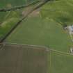 Oblique aerial view centred on the cropmarks of the unenclosed settlement, rig and pits, taken from the SE.