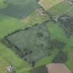 Oblique aerial view centred on the cropmarks of the pits and rig with the farmhouse and farmsteading adjacent, taken from the S.