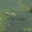 Oblique aerial view centred on the cropmarks of the rig, quarry and possible enclosure, taken from the NNW.