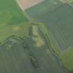 Oblique aerial view centred on the cropmarks of the rig, quarry and possible enclosure, taken from the WNW.