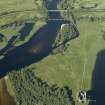 General oblique aerial view centred on the Awe railway viaduct and Strath of Orchy road bridge with the remains of Kilchurn Castle adjacent, taken from the SW.