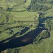 General oblique aerial view centred on the railway viaduct and road bridge, taken from the SSW.