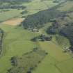 General oblique aerial view centred on the remains of the standing stones and henge, taken from the S.